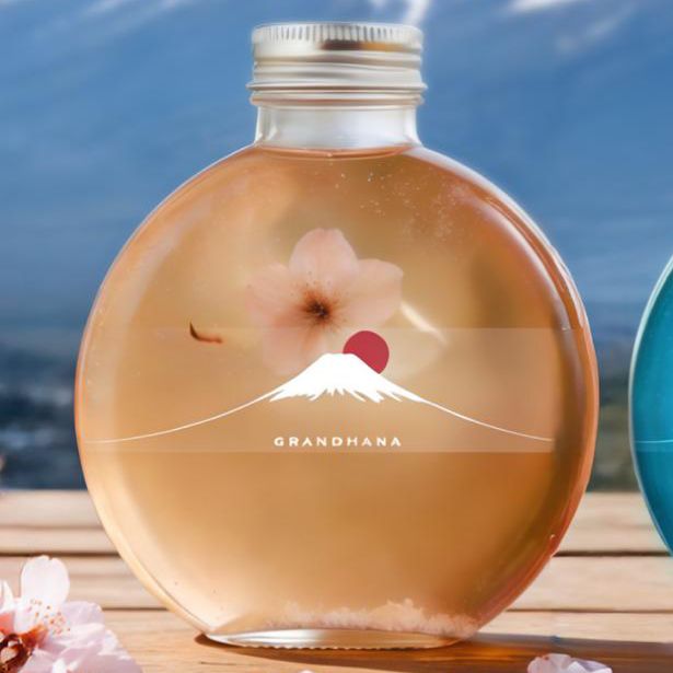 Clear glass bottle of Sakura Lychee Flower Tea with cherry blossom petal at Grandmama Store in Hong Kong