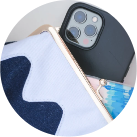 Close-up of a phone inside the open denim Mt. Fuji Pocket Bag at Grandmama Store in Hong Kong.