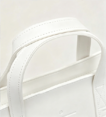 Close-up of reinforced top leather handles on off-white Vintage Soft Leather Convertible Bag at Grandmama Store in Hong Kong