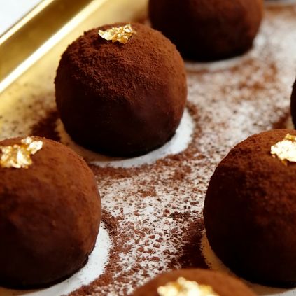 Cocoa-dusted Dubai Chocolate Chewy truffles with gold leaf accents at Grandmama Store in Hong Kong