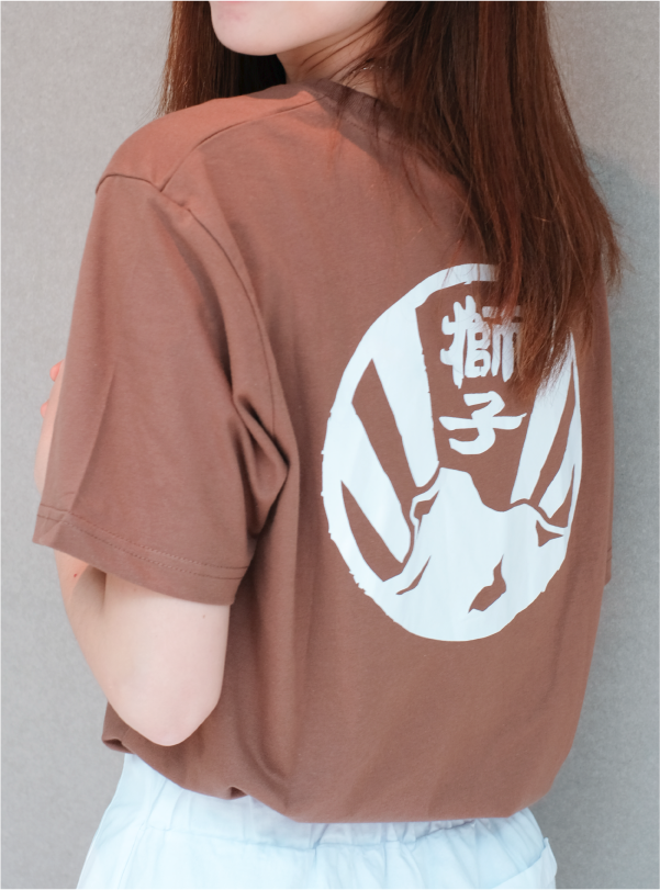 Female model back view of brown Kamon Tee-Lion Rock at Grandmama Store in Hong Kong