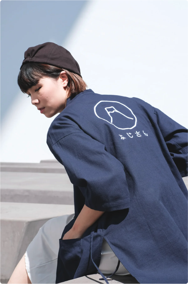 Female model wearing Navy Blue Kamon Kimono Jacket-Fuji San outdoors at Grandmama Store in Hong Kong