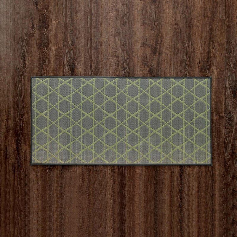 Green IGUSA Rush Grass Floor Mat (Kyukawa Series) on dark wood floor at Grandmama Store in Hong Kong