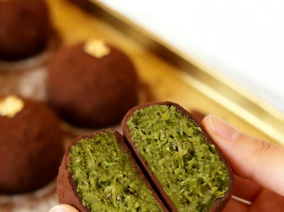 Handmade matcha green tea chocolate truffle with gold leaf at Grandmama Store in Hong Kong.