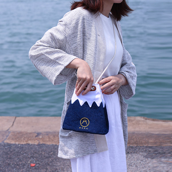 Model holding Small Navy Blue Mt. Fuji Sake Bag outdoors at Grandmama Store in Hong Kong