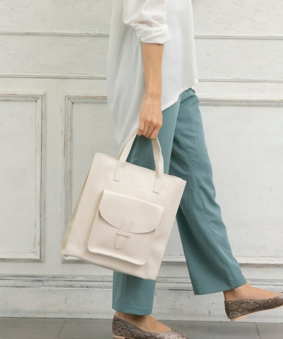 Model holding off-white Vintage Soft Leather Convertible Bag at Grandmama Store in Hong Kong