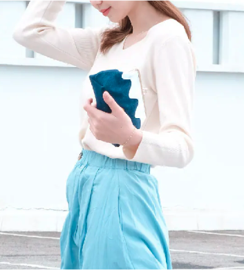 Model holding the Dark Blue denim Mt. Fuji Pocket Bag clutch at Grandmama Store in Hong Kong.