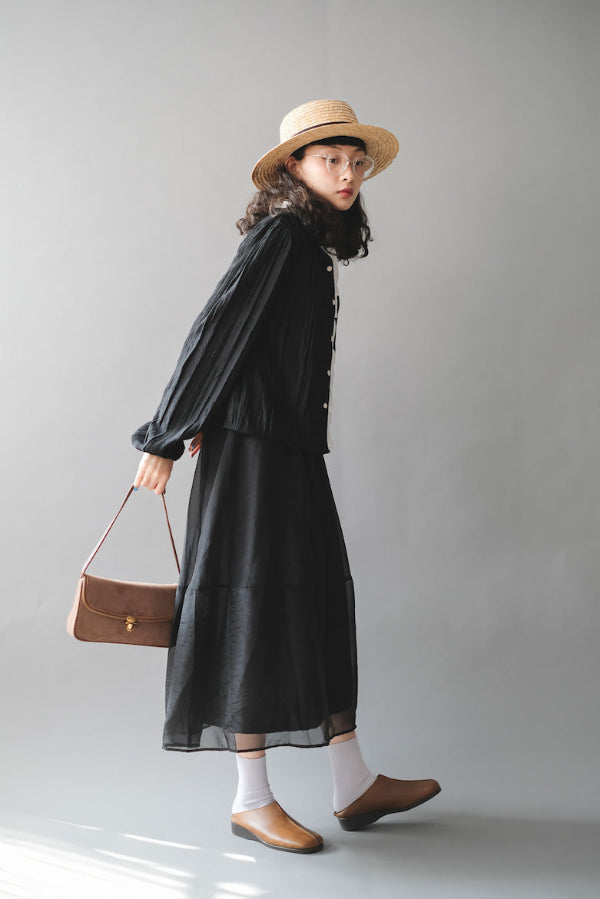 Model styled in black dress and French Straw Boater Hat at Grandmama Store in Hong Kong