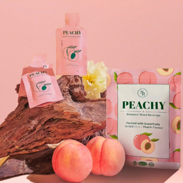 Natural Rhythm Peachy botanical mixed beverage pouches, sachets, and fresh peaches display at Grandmama Store in Hong Kong.