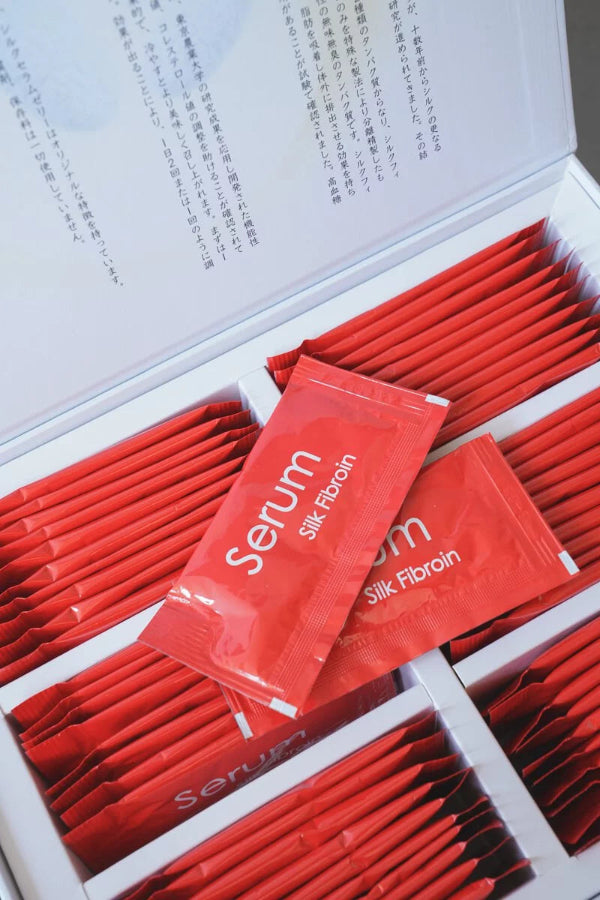 Open box containing red Silk Serum Jelly sachet packets at Grandmama Store in Hong Kong.