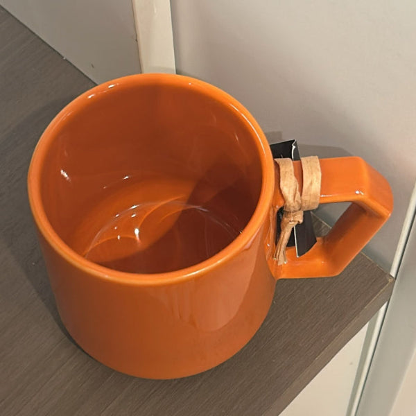 Overhead interior view of orange CHIPS Mug — Ceramic Mug at Grandmama Store in Hong Kong