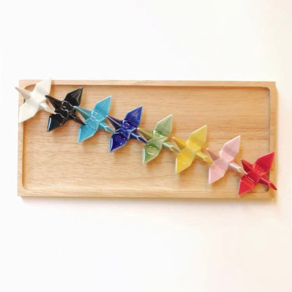 Overhead view of multi-colored Celebration Crane Chopstick Rests on tray at Grandmama Store in Hong Kong