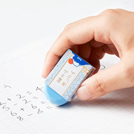 Person erasing pencil marks with a Mount Fuji Eraser at Grandmama Store in Hong Kong