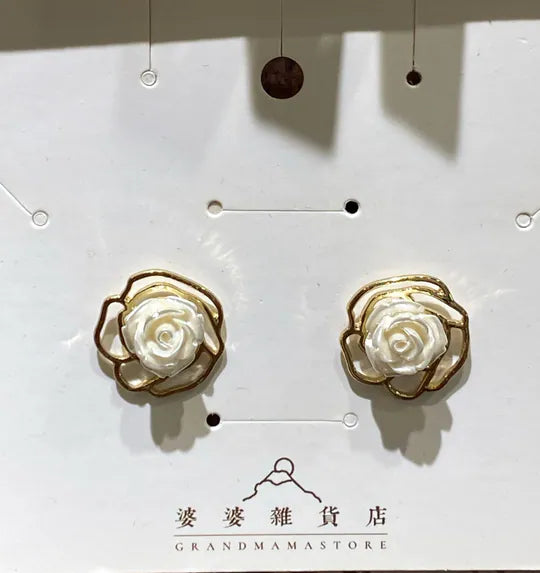 White carved rose gold metal stud earrings at Grandmama Store in Hong Kong