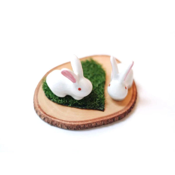 White ceramic Little Rabbit Chopstick Rest pair on wood slice at Grandmama Store in Hong Kong