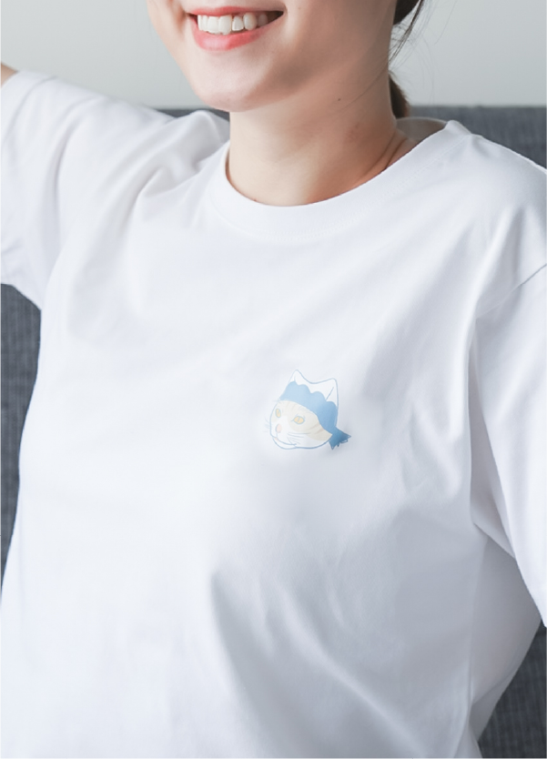 woman-smiling-wearing-white-tee-with-festival-cat-chest-print-Dancing-Cat-Tee-Hong-Kong-Kwun-Tong-Grandmama-store