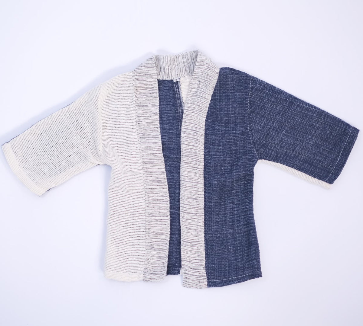 Front flat lay view of the Hand-cranked Kids Kimono jacket in Mt. Fuji blue at Grandmama Store in Hong Kong.